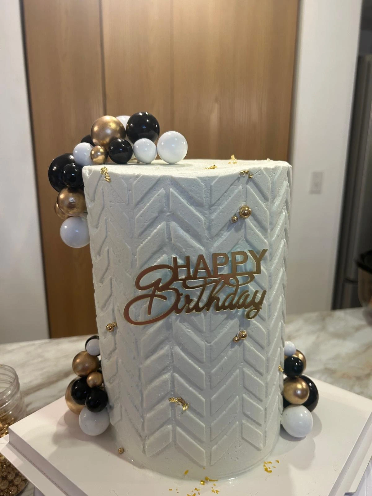 Geometric birthday cake with gold accents