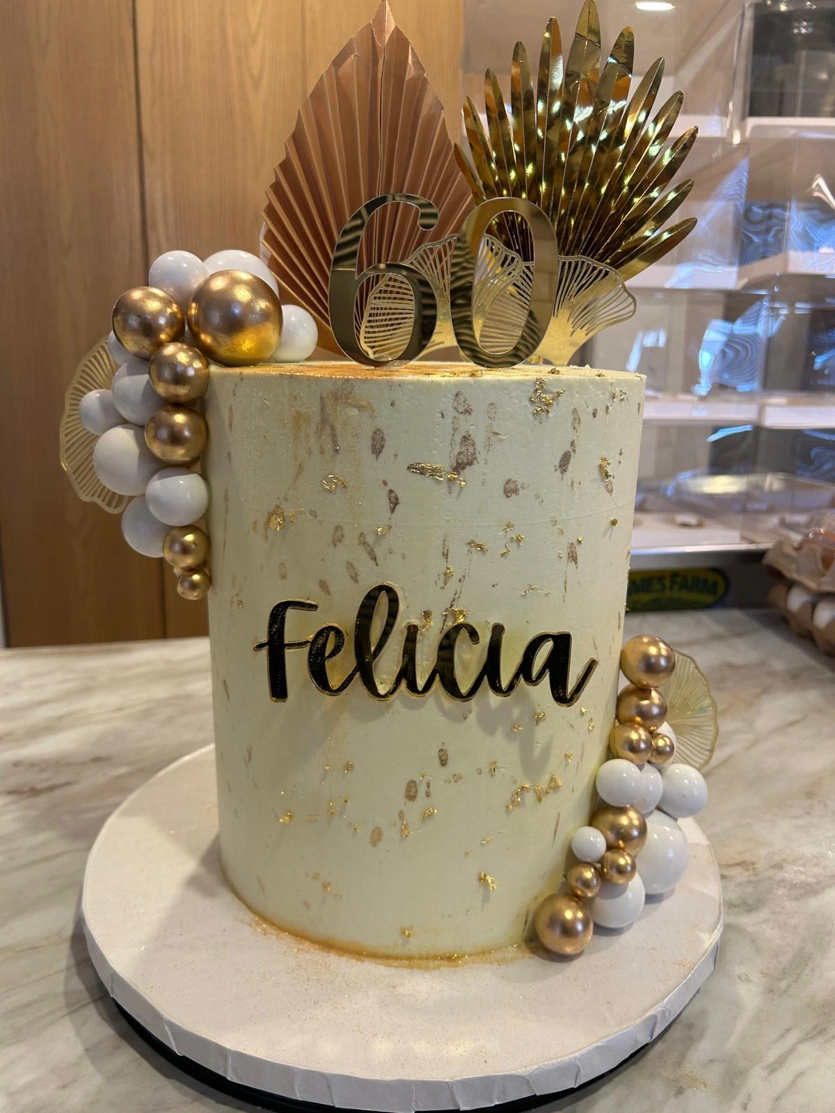 A gold-accented milestone cake