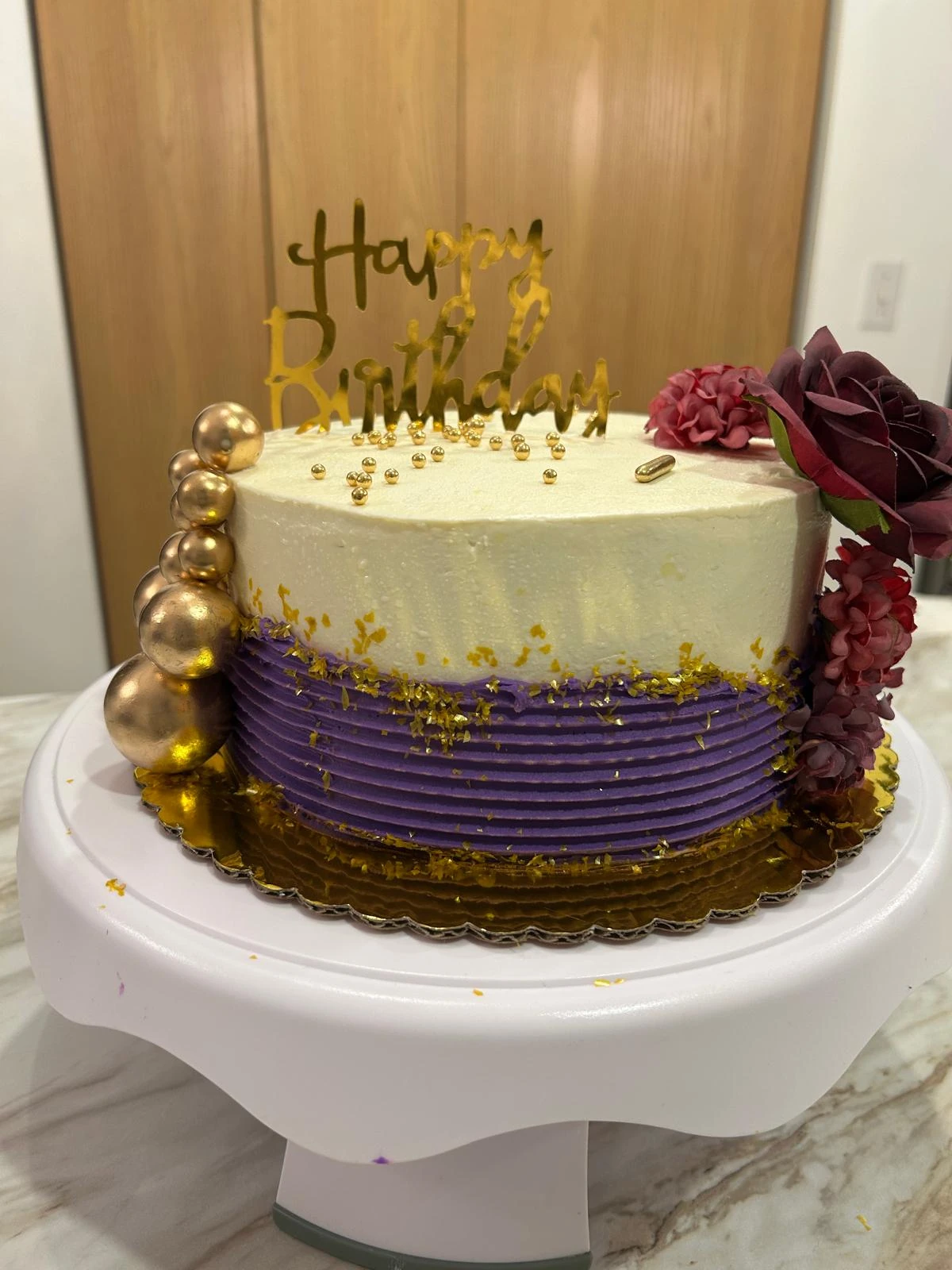 Gold and purple floral celebration cake