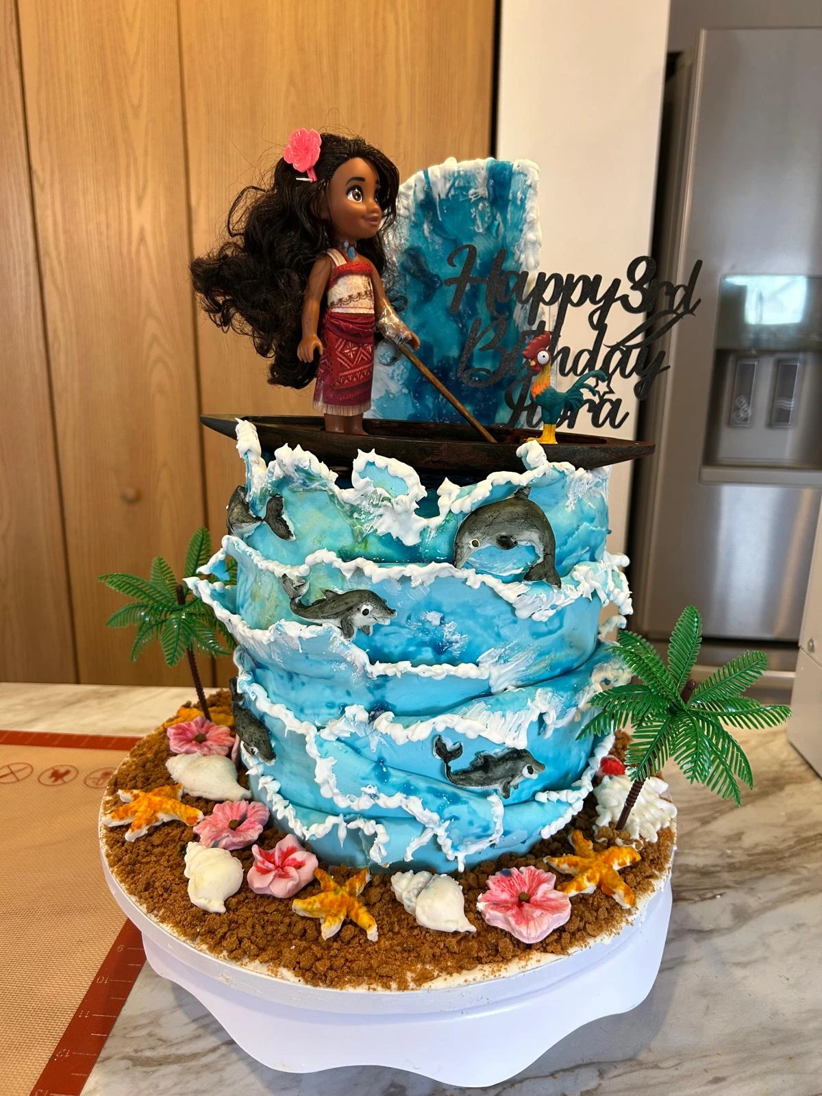 Moana birthday cake with sculpted ocean waves