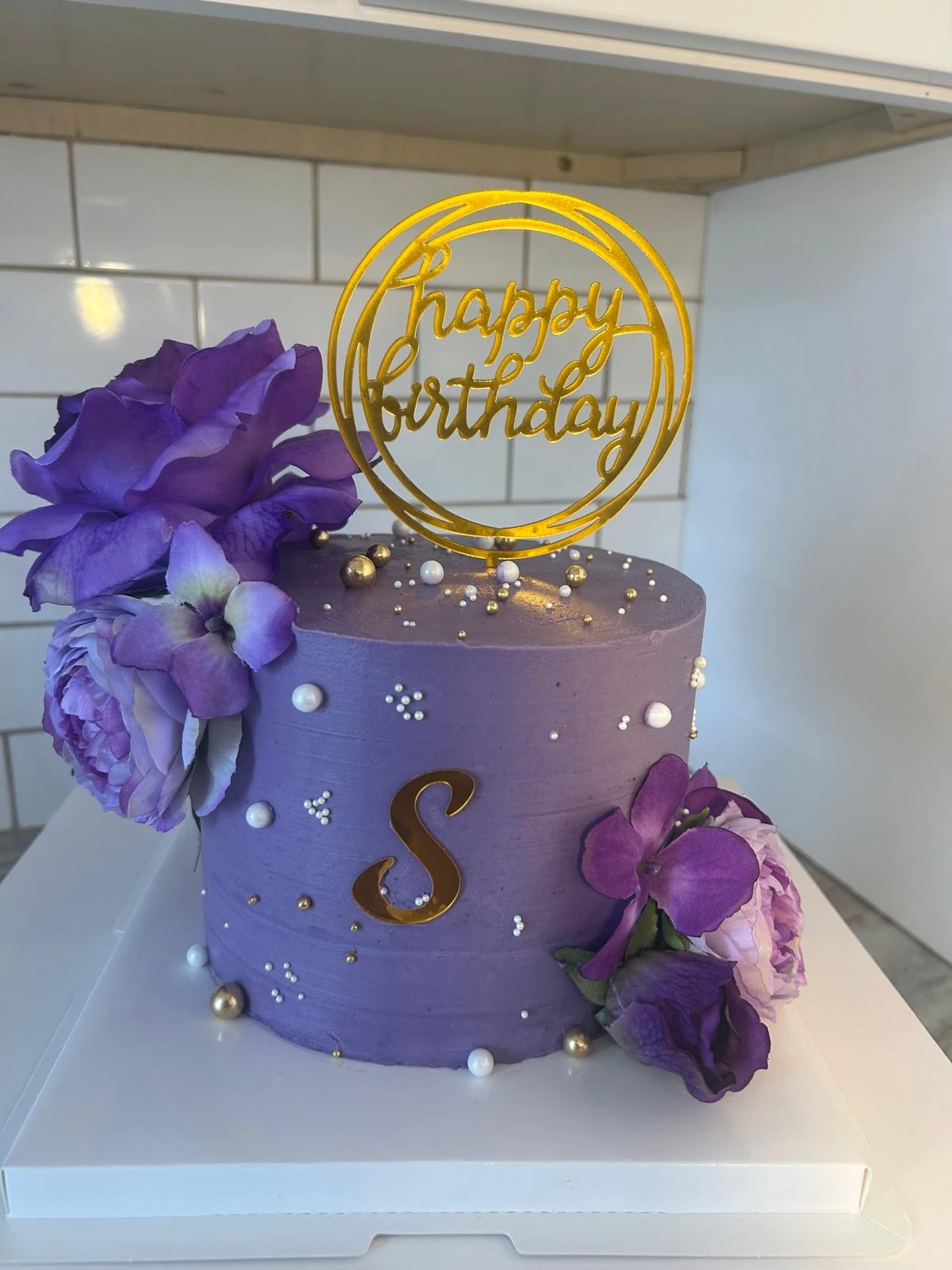 Purple floral celebration cake