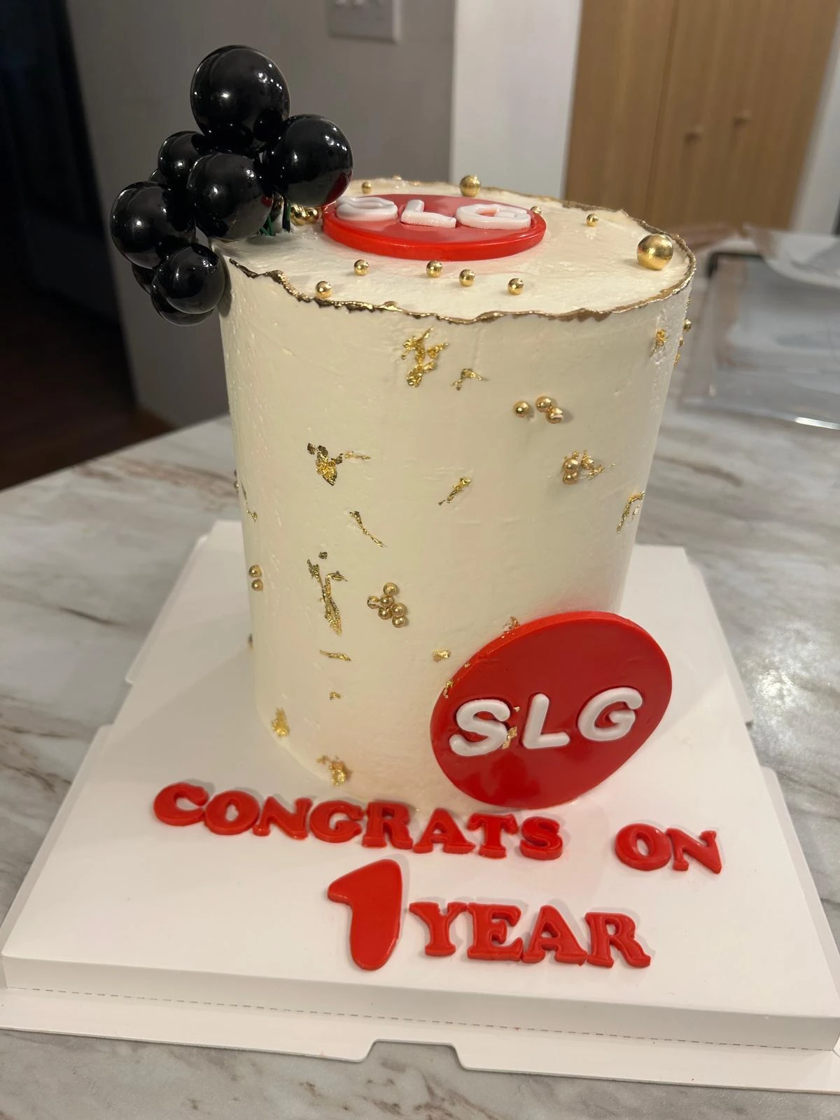 Corporate anniversary cake with gold details