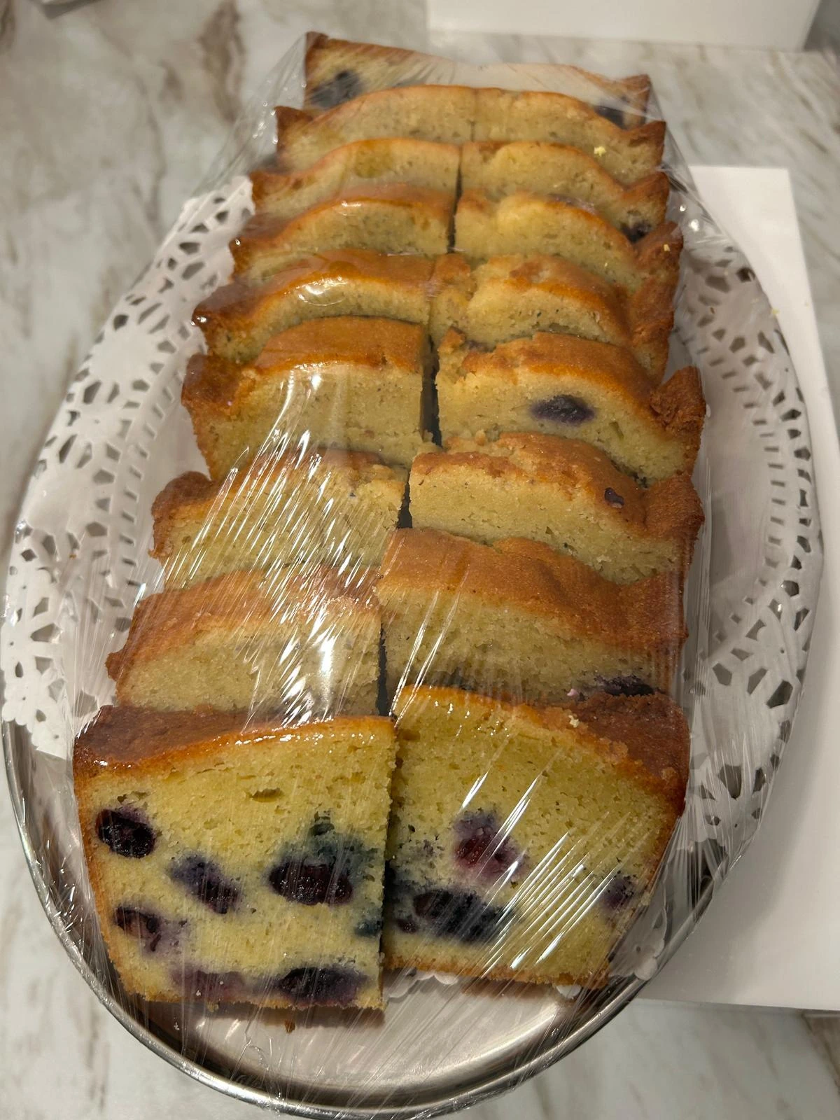 Golden loaf cake sliced for sharing