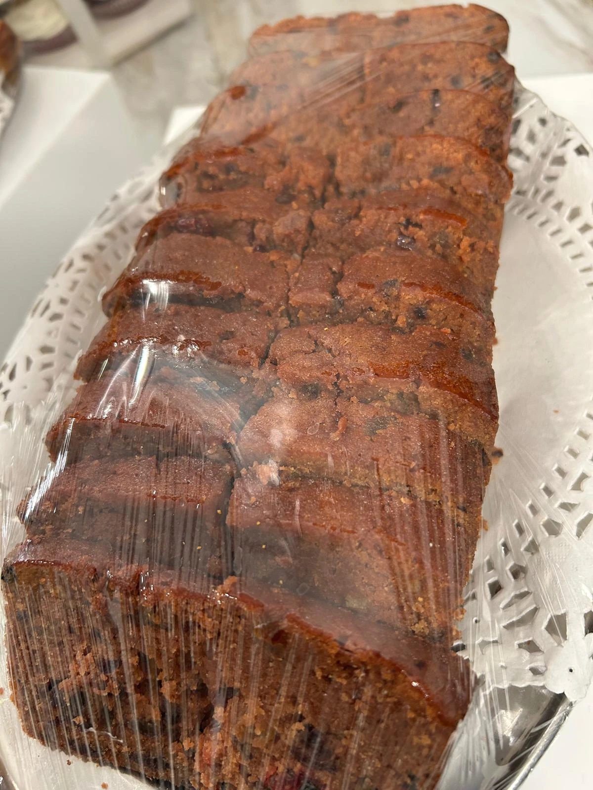 Rich brown loaf cake sliced for a gathering