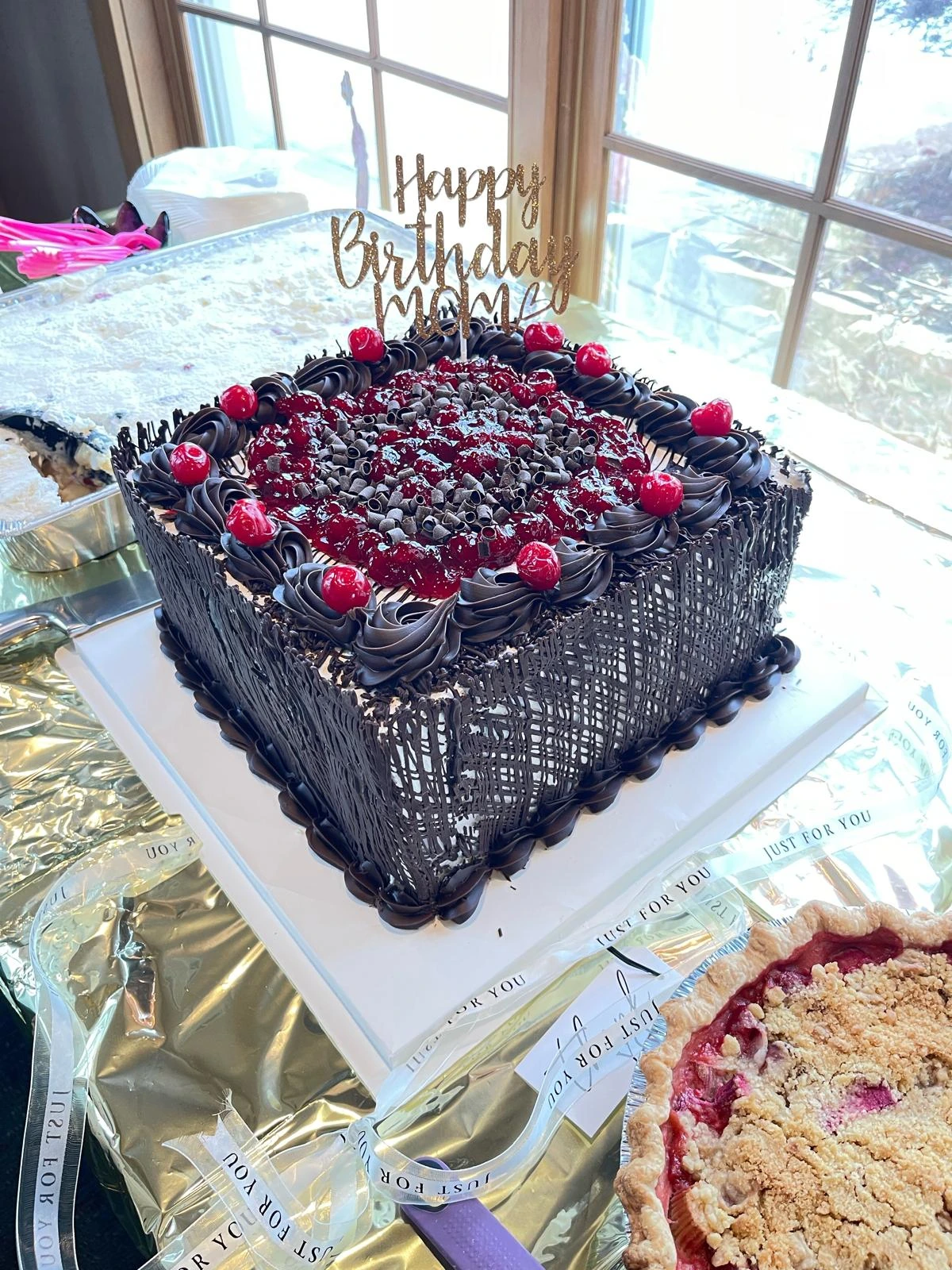 Chocolate sheet cake with cherries and piped details