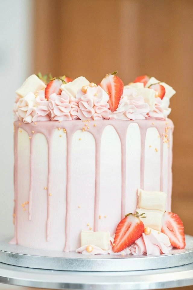 Pink strawberry drip celebration cake